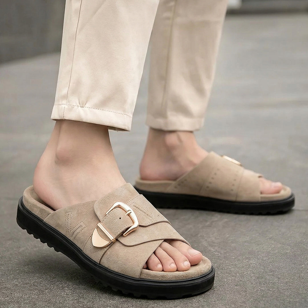 Beige slip-on sandals with gold buckle detail and black sole for women