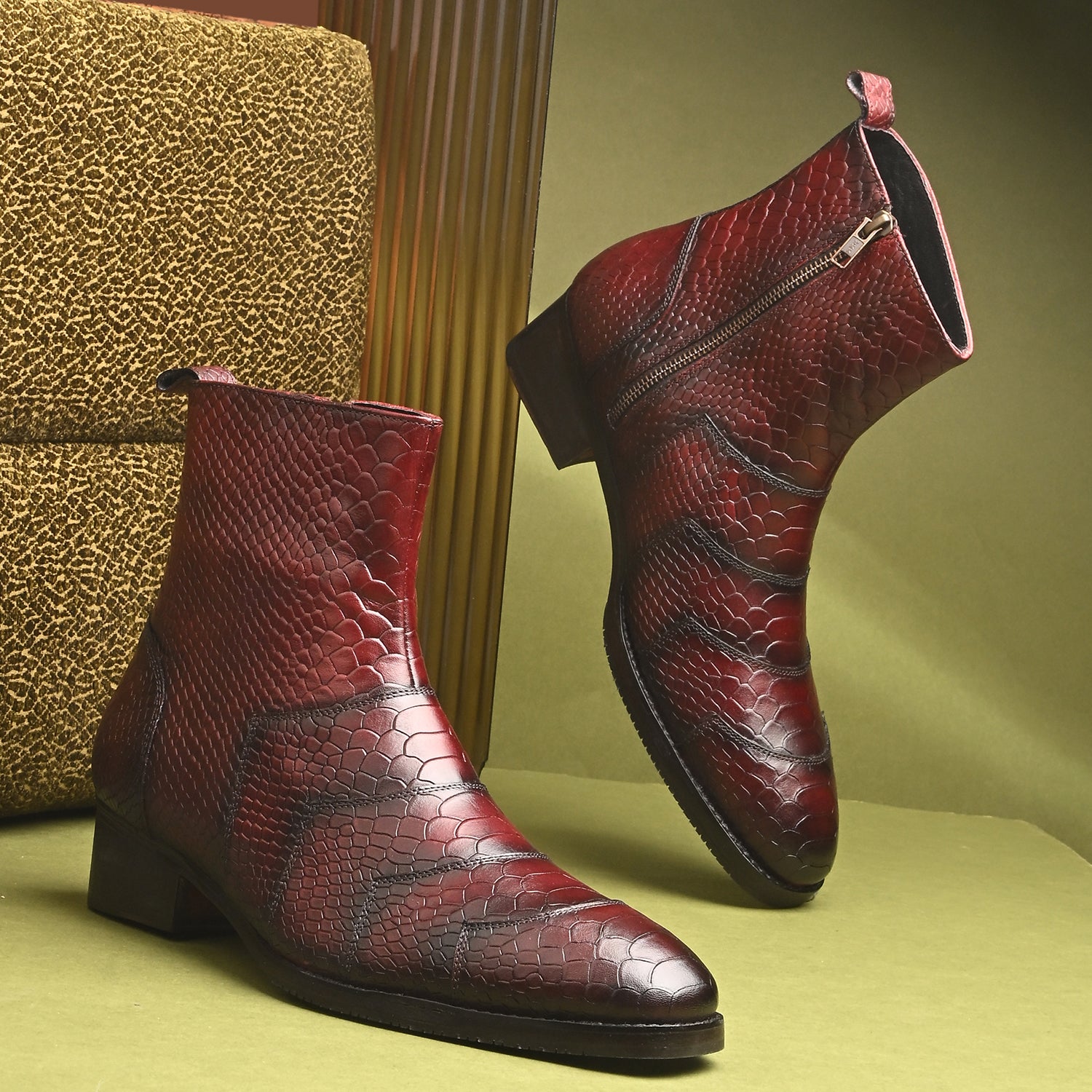 “Burgundy python-print leather men’s ankle boots with side zipper and low heel”