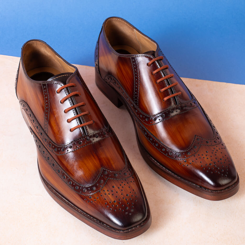 "Federico Smith Gilbert Cognac Patina Oxford, handcrafted from high-quality leather with a rich patina finish, cushioned insole, and leather sole for elegance and comfort."