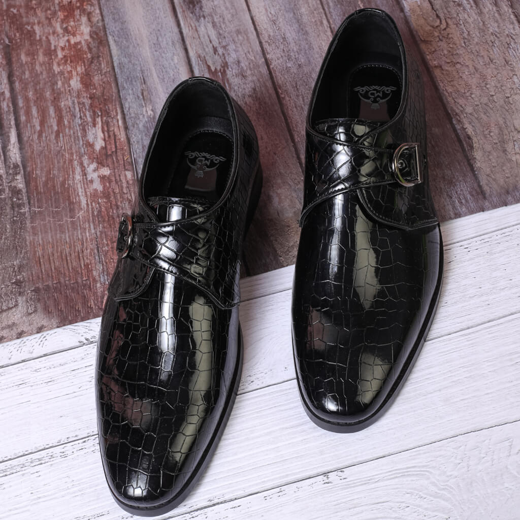 "Black single patent croco monk strap shoe with a sleek finish, anti-skid leather sole, and timeless design for versatile luxury and sophistication."