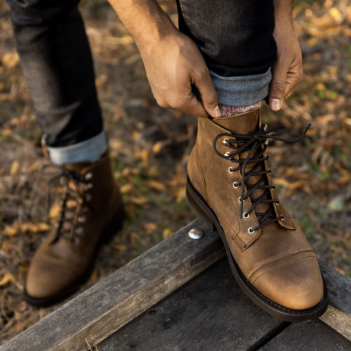 Ember Crest Burnt Copper Leather Boots with a rich burnt copper hue, lightweight Dainite sole, Goodyear welt construction, glove leather lining, cork-bed midsoles for custom fit, and reinforced eyelets.

