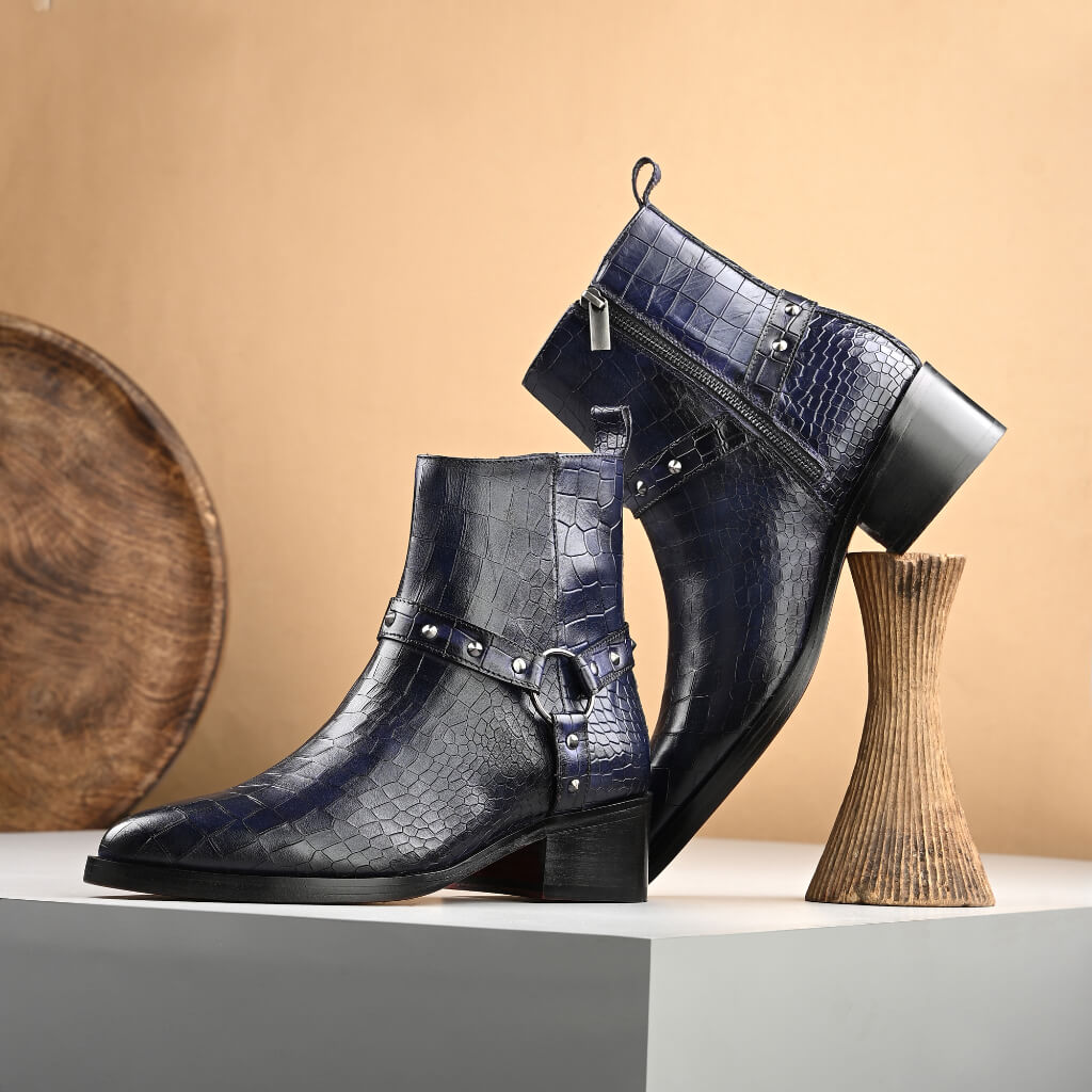 "Mille Dollari Men’s Midnight Blue Croc-Embossed Cowboy Boots—handcrafted with premium croc-embossed leather, a bold harness strap with metallic rivets, and a side zipper for style and functionality."





