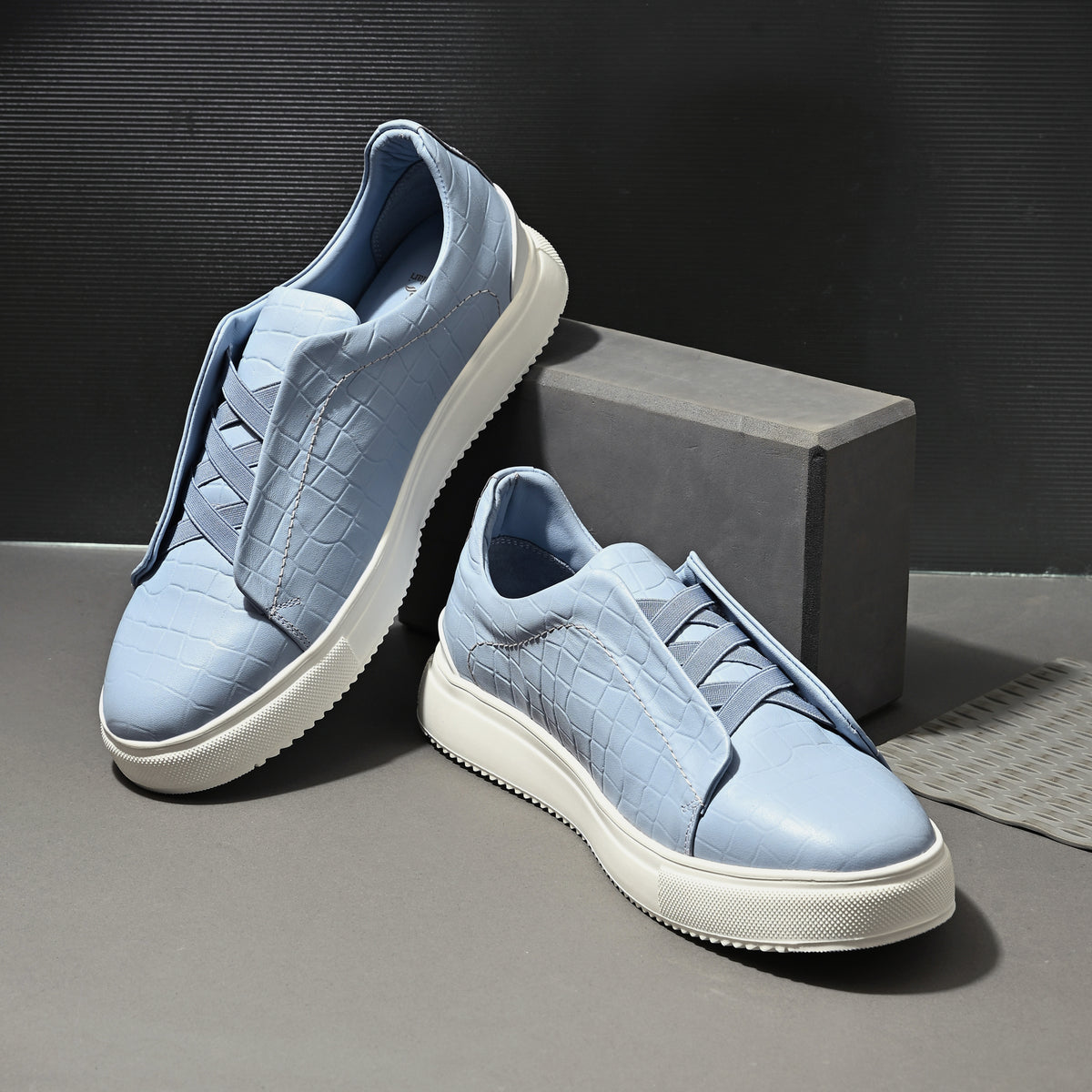 Men's light blue Italian imported calf leather sneakers with textured finish, tonal laces, memory foam cushioning, and off-white rubber sole