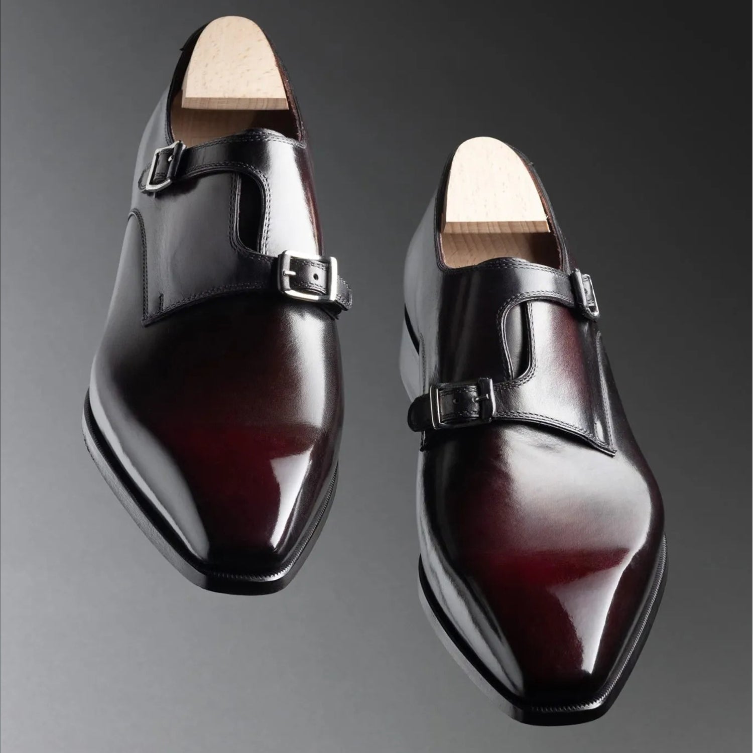 Luxury men's burgundy patina genuine leather asymmetrical double monk strap formal dress shoes featuring a hand-painted wine finish, polished leather upper, square toe design, dual buckle closure, cushioned footbed, and premium craftsmanship for weddings, office wear, business meetings, and formal occasions.
