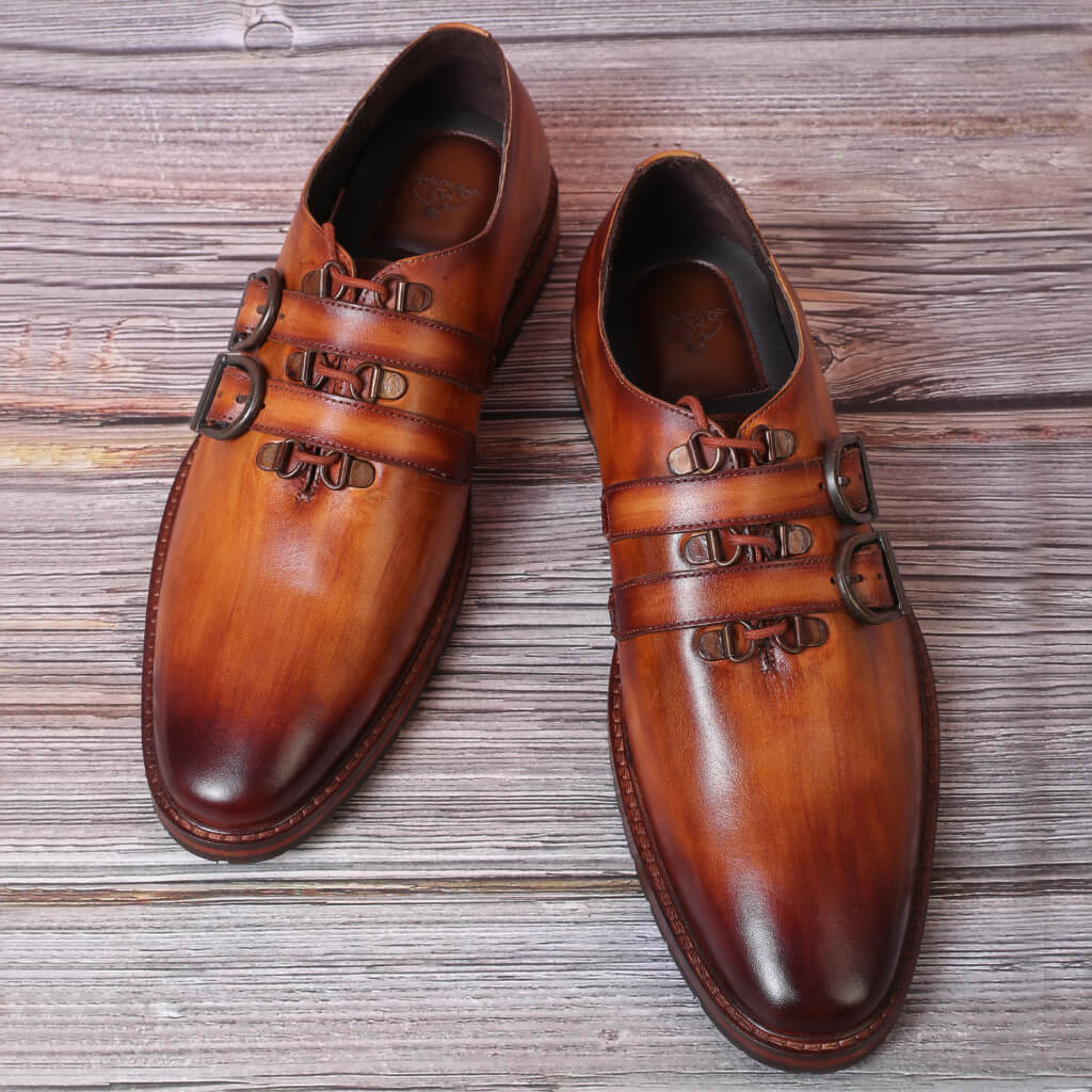 "Curry Tan Mille Dollari Armando Designer Monkstraps, crafted from premium leather with a sleek tan finish, double-buckle design, and sophisticated silhouette."

