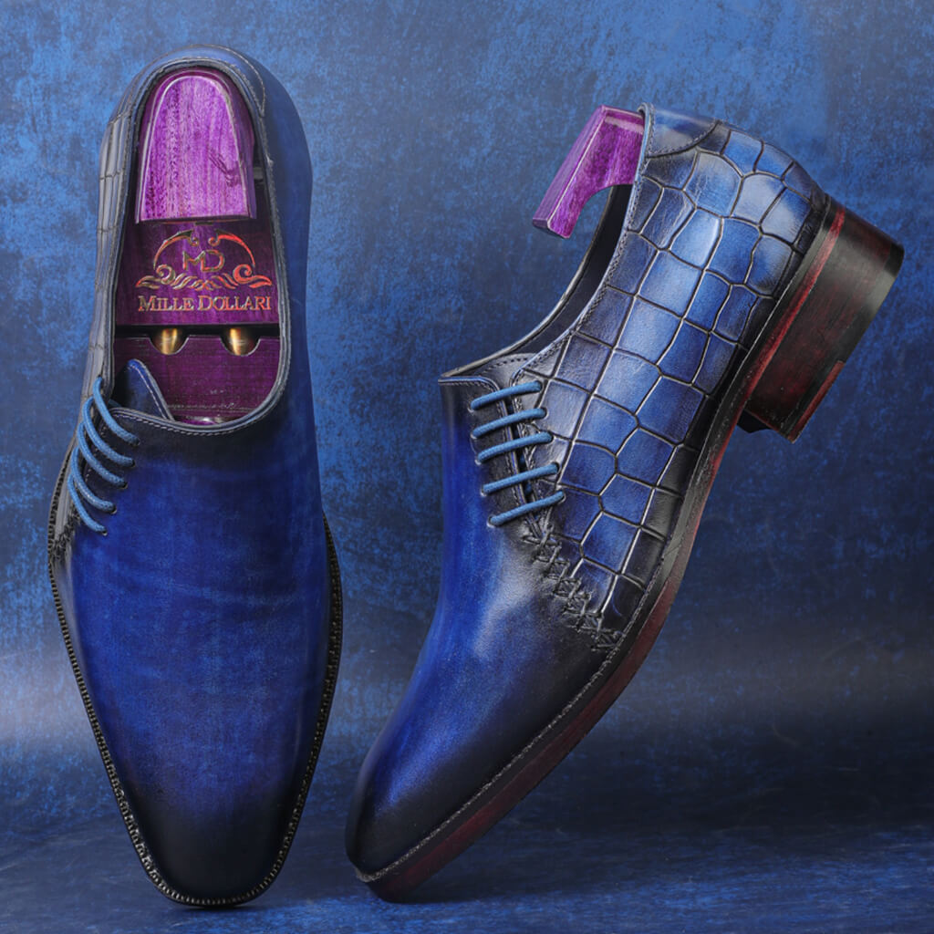 "Callahan Comfort Smokey Blue Cut Croco Textured Oxfords by Mille Dollari, featuring a handpainted patina finish, croco-textured upper, and luxurious craftsmanship."

