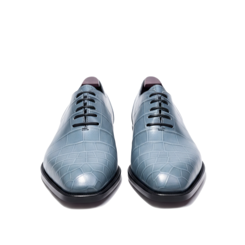 Blue crocodile pattern leather Oxford dress shoes for men with lace-up design on white background