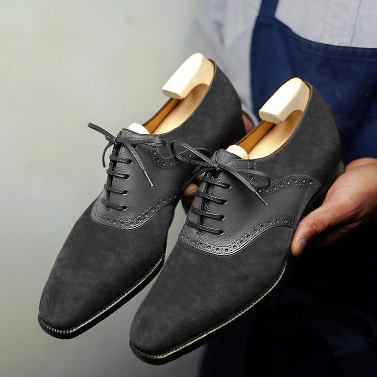 Handmade grey suede Oxford dress shoes for men featuring premium leather, wingtip brogue detailing, closed-lace design, and luxury formal craftsmanship.