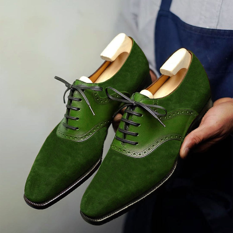 Handmade green suede Oxford dress shoes for men featuring premium leather, wingtip brogue detailing, closed-lace construction, and luxury formal craftsmanship.